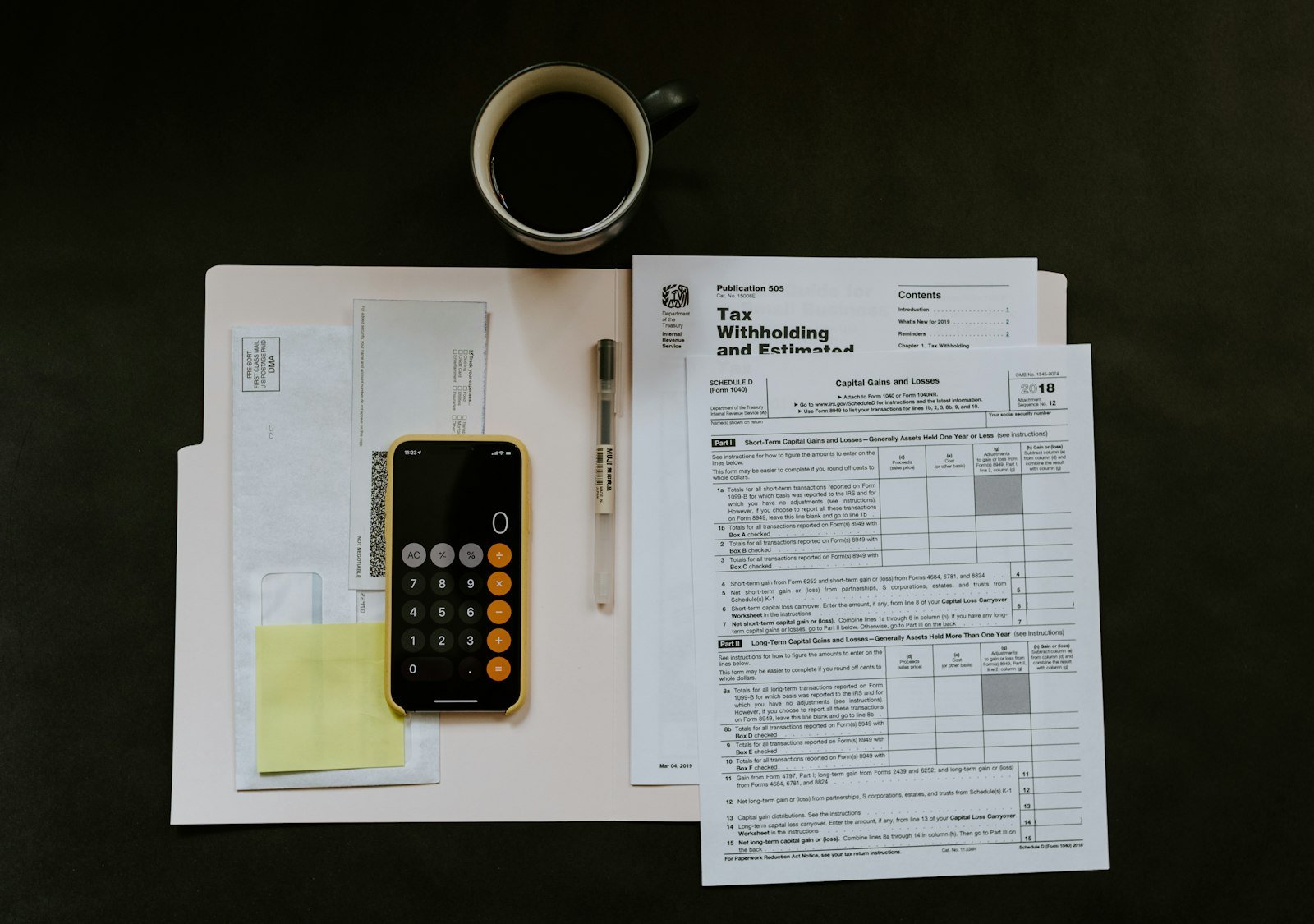 Paperwork and pen on a desk before an application