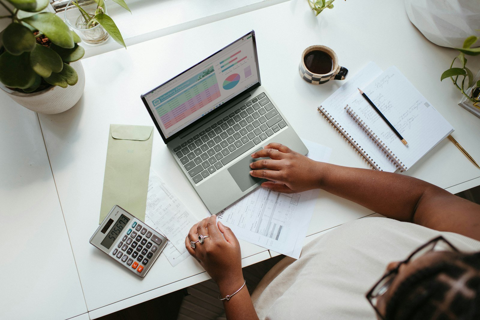 Person reviewing finances on a laptop at home
