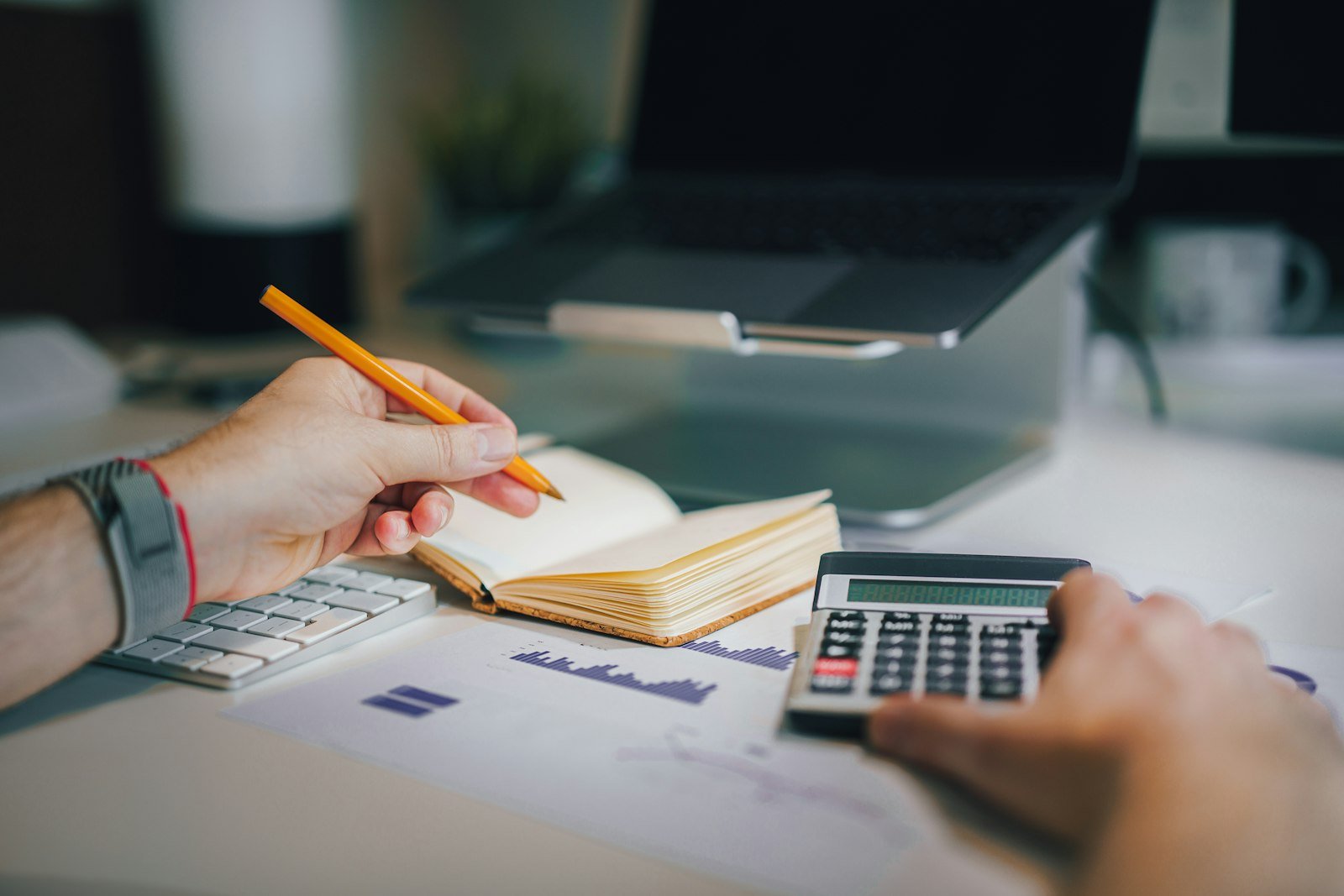 Calculator and currency on a desk